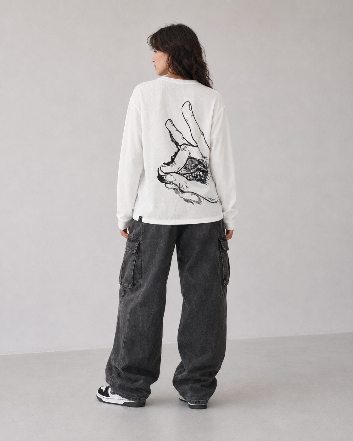Model wearing Berserk Hand & Eclipse Eye Long Sleeve Shirt, styled view 5