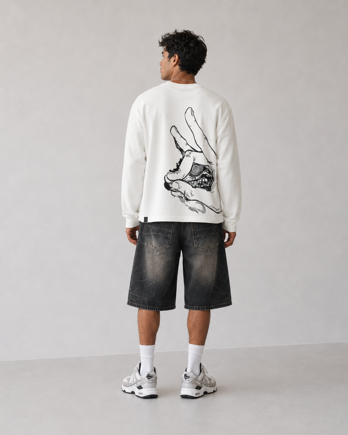 Model wearing Berserk Hand & Eclipse Eye Long Sleeve Shirt, styled view 4