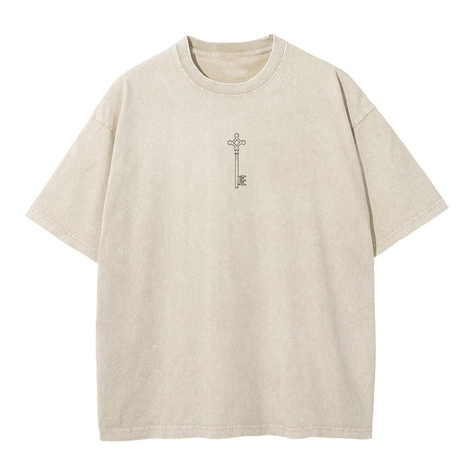 Front view of vintage sand acid wash tee featuring minimalist Attack on Titan basement key graphic.