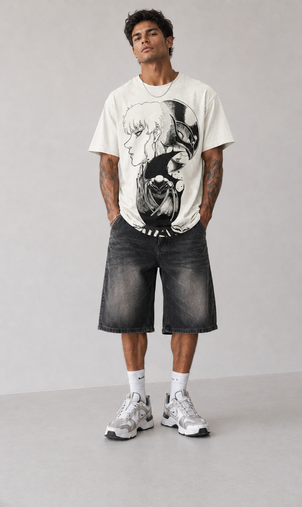 Male model wearing Berserk Guts & Griffith Split Portrait Oversized T-Shirt