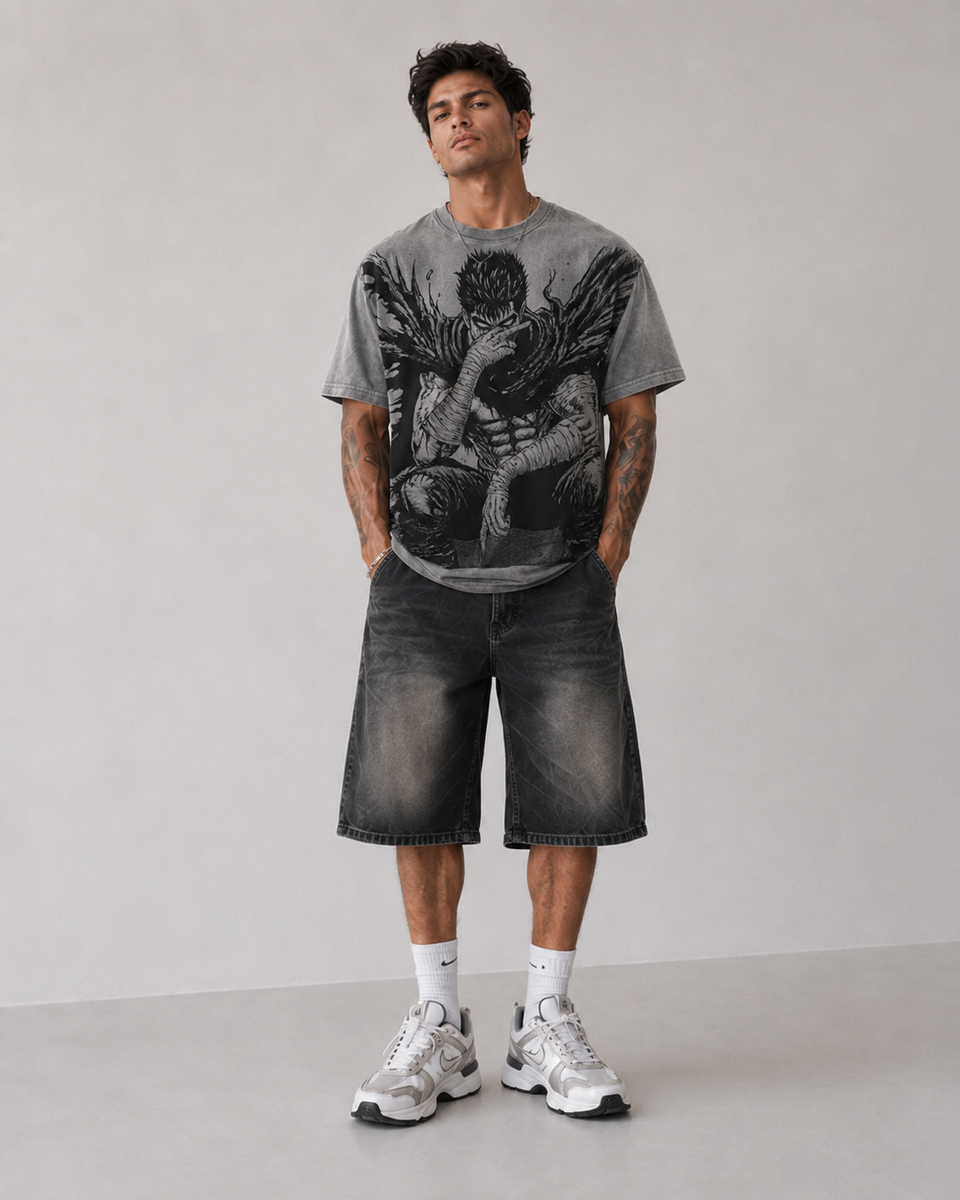 Male model wearing Berserk Guts Seated Manga Oversized T-Shirt
