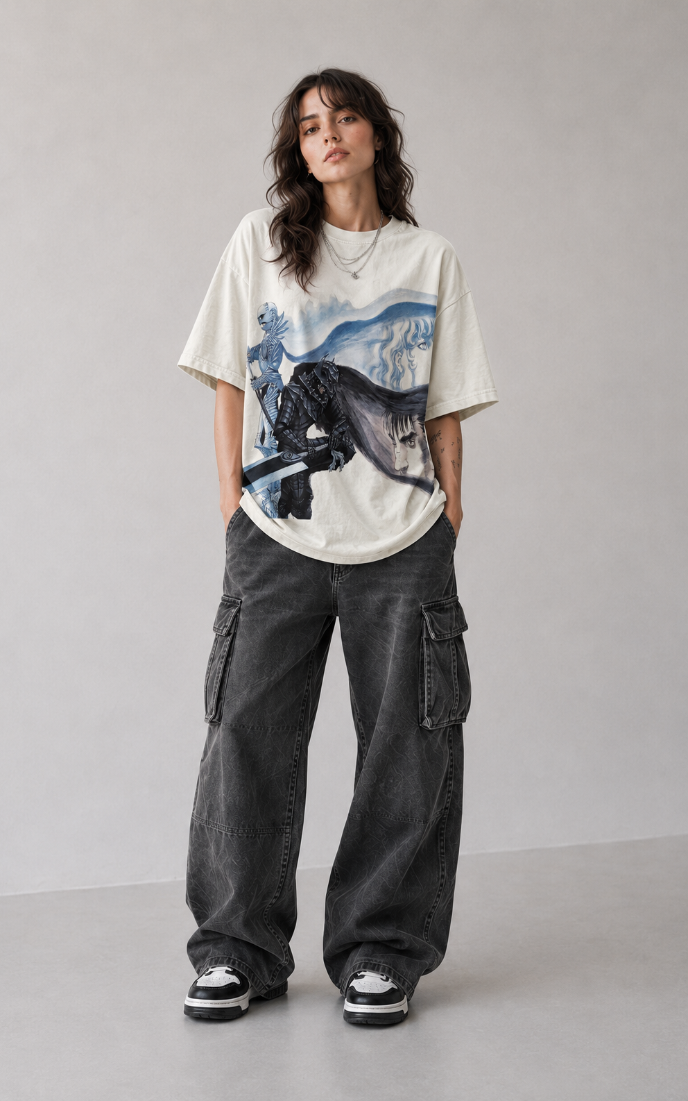 Female model wearing Berserk Guts Blue Swordsman Oversized T-Shirt