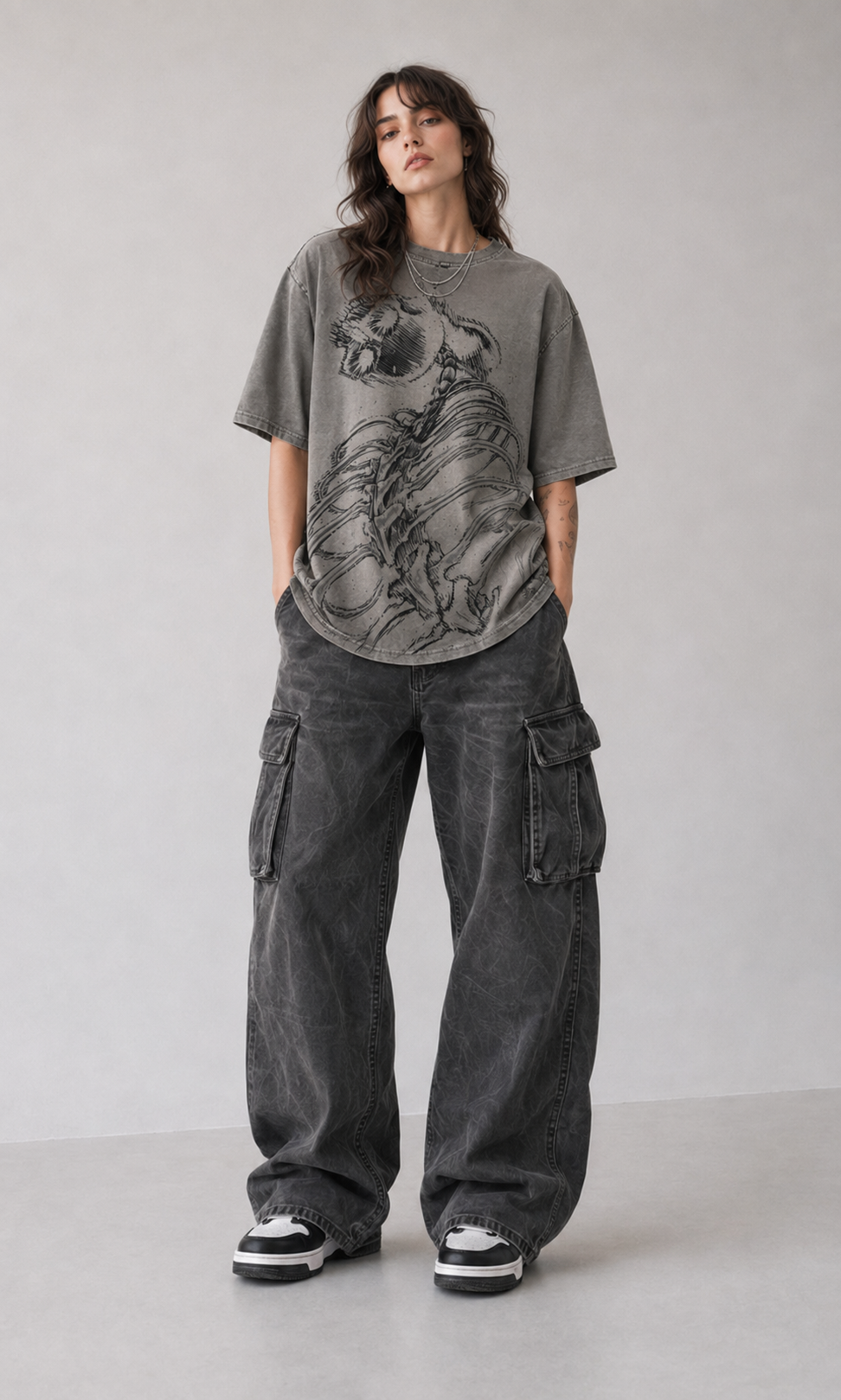 Female model wearing Attack on Titan Eren and Colossal Titan Oversized T-Shirt