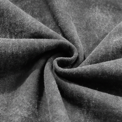 Close up of distressed frayed ribbed collar on a vintage grey acid wash heavyweight t-shirt.