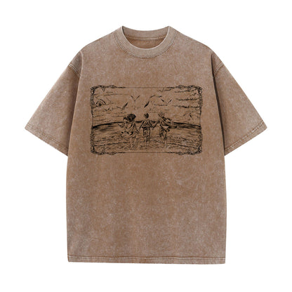 Front view of vintage brown acid wash t-shirt featuring framed graphic of Eren, Mikasa, and Armin at the ocean.