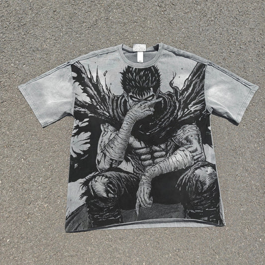 T-shirt with a graphic design of a character sitting on the ground, covering their face, on a textured surface.