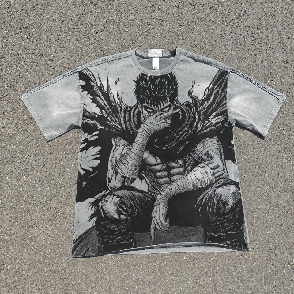 T-shirt with a graphic design of a character sitting on the ground, covering their face, on a textured surface.