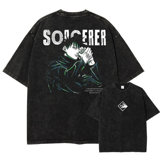 Front and back view of oversized 240 GSM vintage black acid wash tee. Front features minimalist white Divine Dog hand sign logo. Back features Megumi Fushiguro forming a hand sign with distressed Sorcerer typography and green highlights