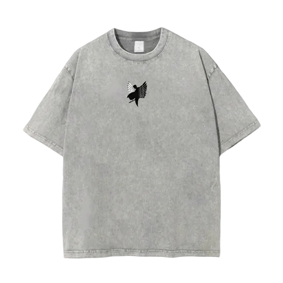 Front view of oversized 240 GSM vintage grey acid wash t-shirt featuring minimalist black and white Attack on Titan Wings of Freedom silhouette center-chest logo.