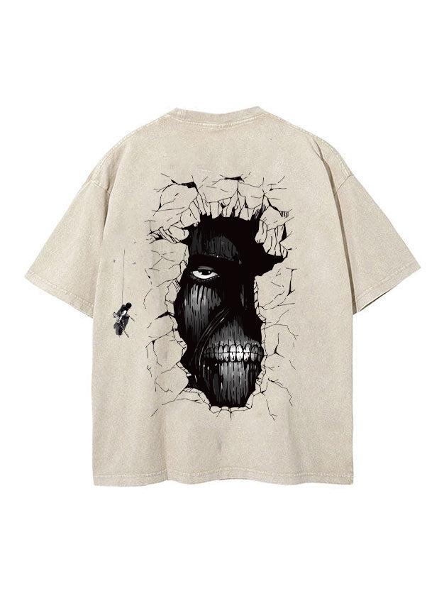Back view of vintage sand Attack on Titan t-shirt featuring ominous Wall Titan face looking through a cracked wall with a Scout swinging on ODM gear.