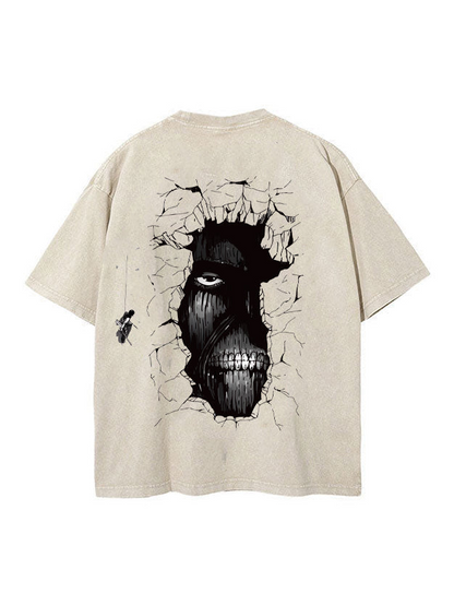 Back view of vintage sand Attack on Titan t-shirt featuring ominous Wall Titan face looking through a cracked wall with a Scout swinging on ODM gear.
