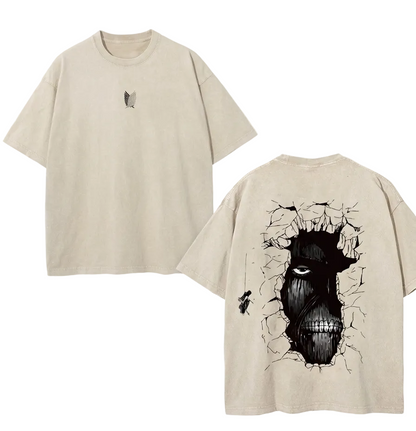 Front and back view of 240 GSM vintage sand acid wash tee. Front features center-chest Survey Corps logo. Back features massive Wall Titan face breaking through cracked wall graphic.